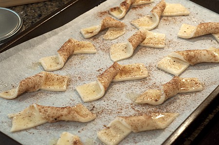 Cut the dough into strips about 4” long and 1 ½” wide. Cut the dough into strips about 4” long and 1 ½” wide.