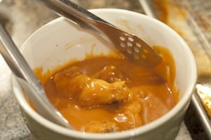 Coating Baked Buffalo Wings with Sauce