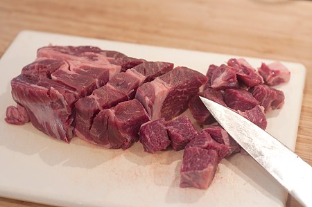 Cutting chuck roast for Garlicky Beef Stew Cutting chuck roast for Garlicky Beef Stew