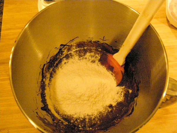 Adding flour mixture to wet ingredients.