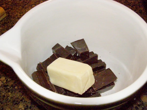 Chocolate and butter in a mixing bowl.