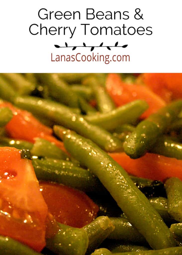 Green beans and cherry tomatoes on a serving dish.