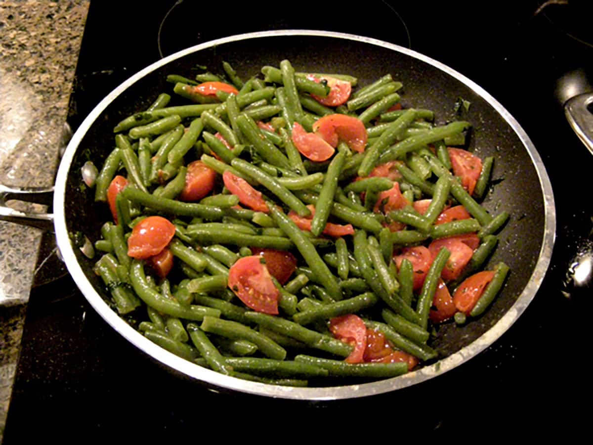 Green beans and tomato sauce tossed together.