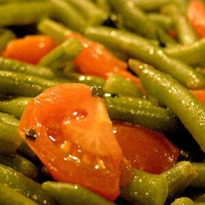 Green Beans with Cherry Tomatoes - A quick side dish perfect for roasted or fried chicken, pork, or even beef. Make it in minutes! https://www.lanascooking.com/green-beans-with-cherry-tomatoes/