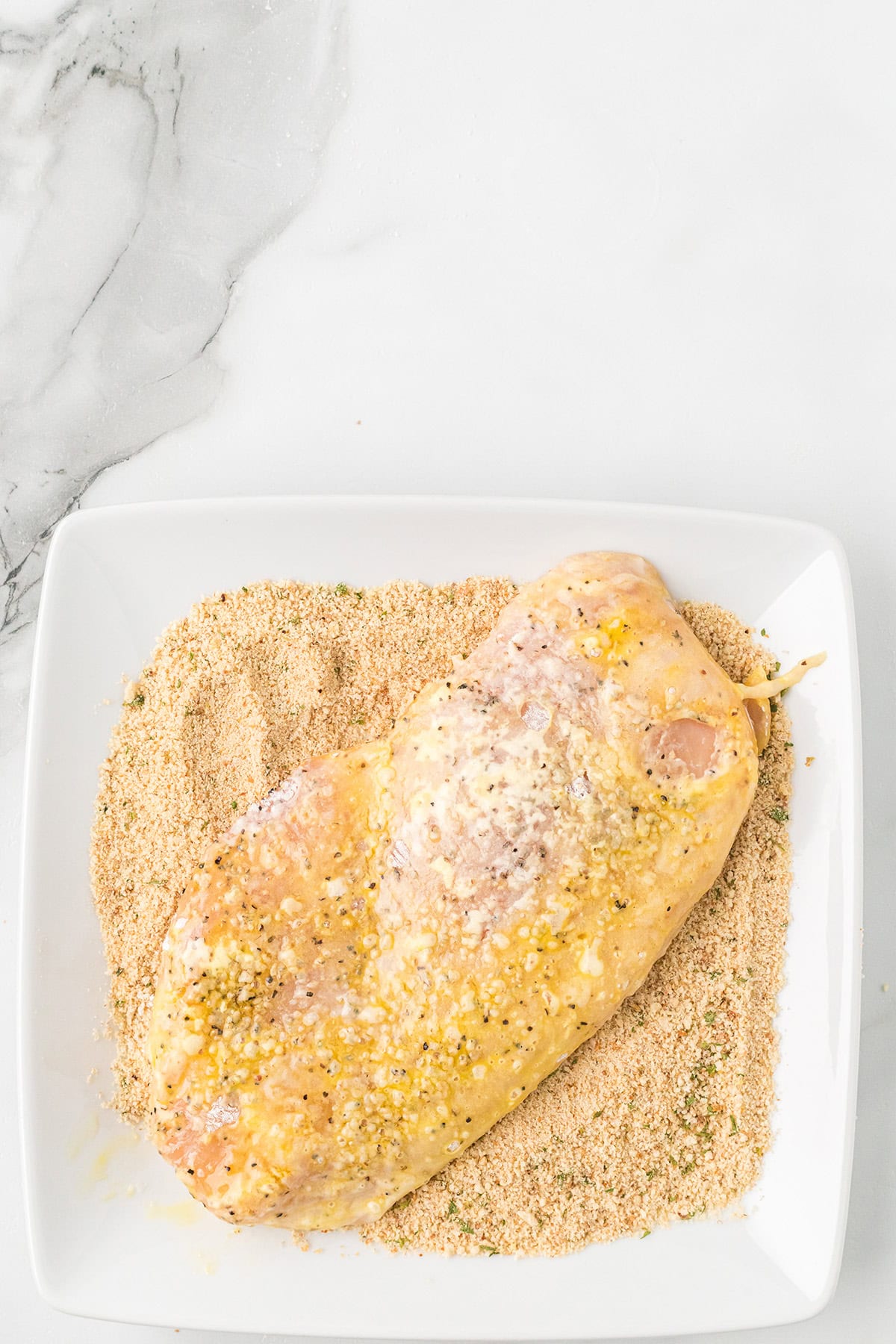 Breast dipped in breadcrumbs.