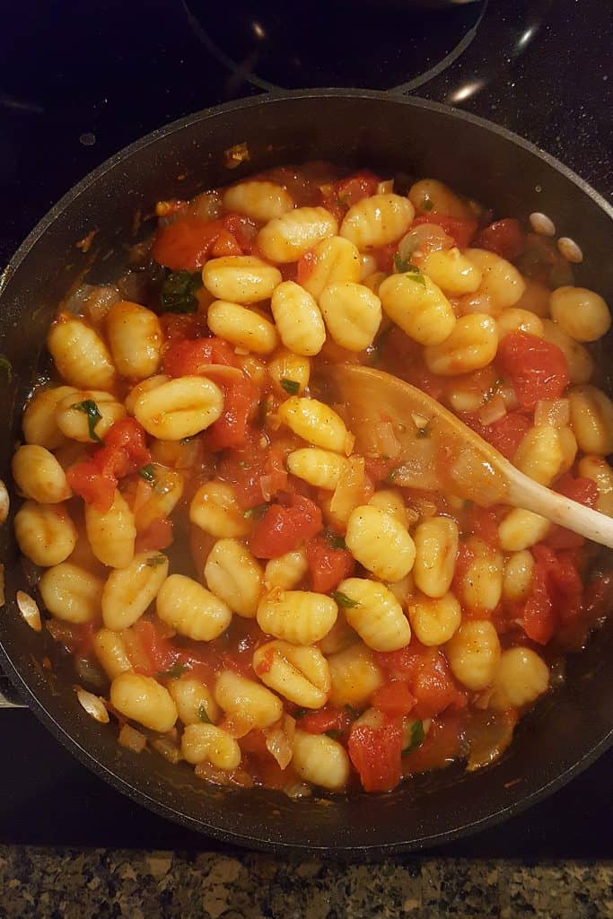 Gnocchi mixed with tomato sauce