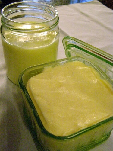 Finished butter and buttermilk in glass containers.