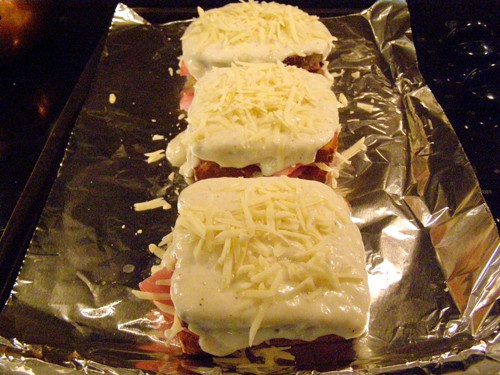 Cheese sauce and grated cheese added to tops of bread.