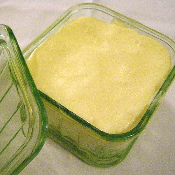 A glass container of butter.