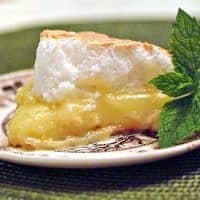 Classic Lemon Meringue Pie - tart, sweet, and perfect for summer. Perfect for summer picnics and makes a sweet ending for warm weather dinners https://www.lanascooking.com/lemon-meringue-pie/