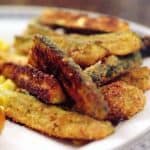 Zucchini Fries are a great way to use extra zucchini! These "fries" are coated with bread crumbs and Parmesan and baked until golden brown. https://www.lanascooking.com/zucchini-fries/