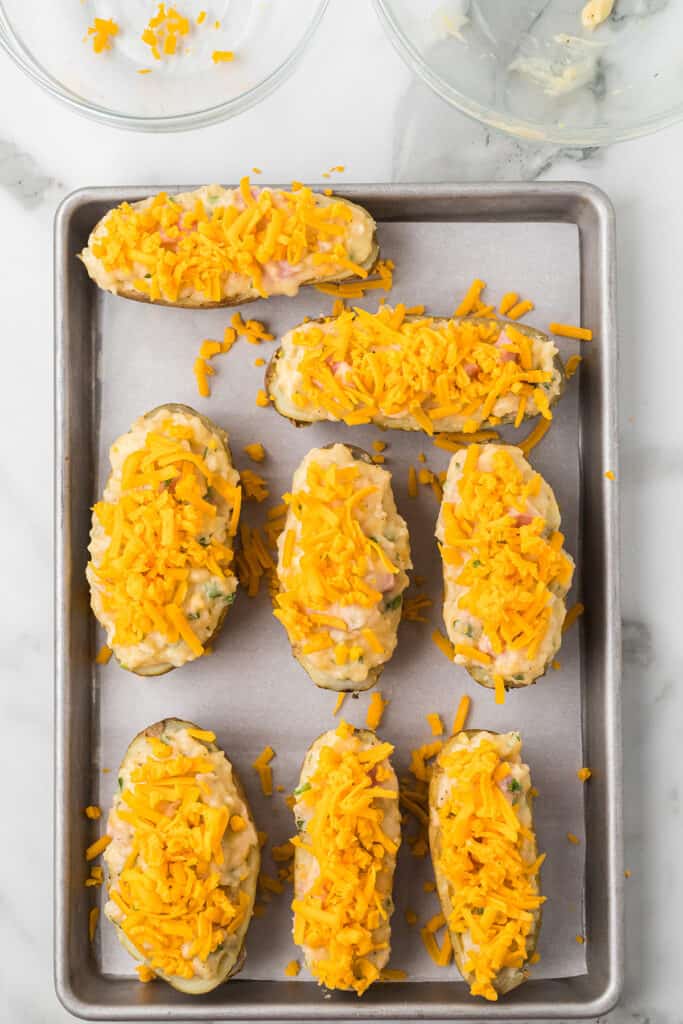 Potato halves topped with cheese.