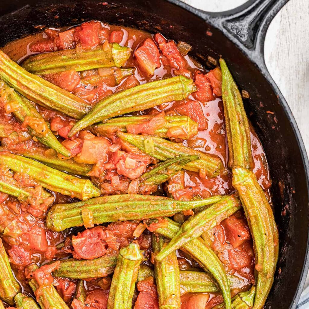 Finished okra and tomatoes in a cast iron skillet.