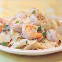 Creamy shrimp and pasta - succulent shrimp in a creamy Parmesan sauce served over egg noodles. https://www.lanascooking.com/creamy-shrimp-and-pasta/