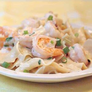 Creamy shrimp and pasta - succulent shrimp in a creamy Parmesan sauce served over egg noodles. https://www.lanascooking.com/creamy-shrimp-and-pasta/