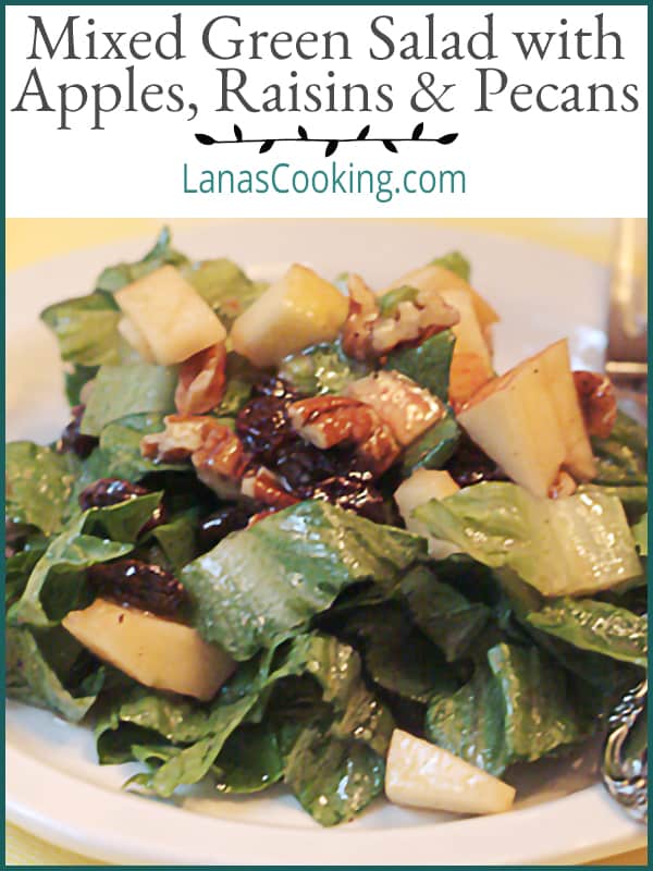 This Mixed Green Salad with Apples Raisins and Pecans contains all the elements of the classic Waldorf Salad dressed with a red wine vinaigrette. https://www.lanascooking.com/fruited-green-salad/