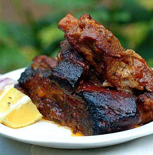 Slow Cooker Barbecued Ribs - These luscious, fall-off-the-bone tender ribs are prepped in a jiffy and cook long and low in the slow cooker. https://www.lanascooking.com/slow-cooker-ribs/