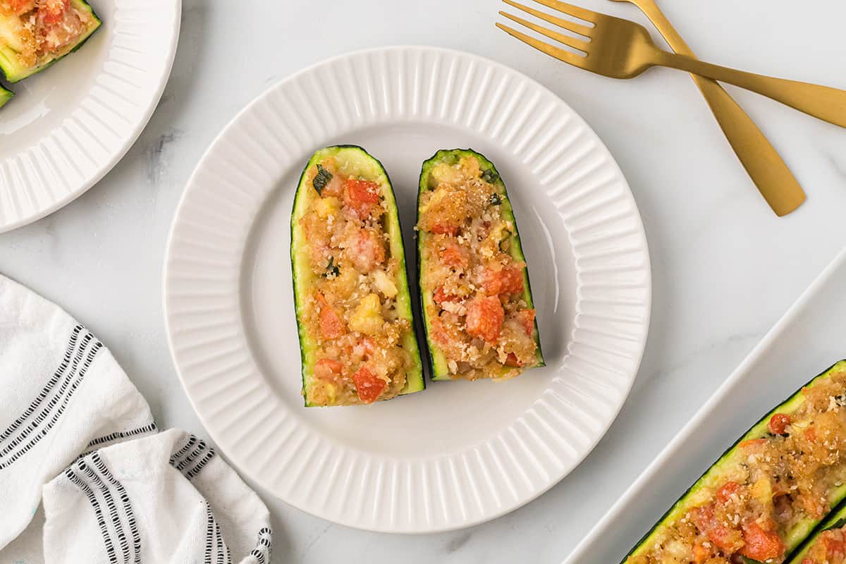 A serving of zucchini on a white plate.