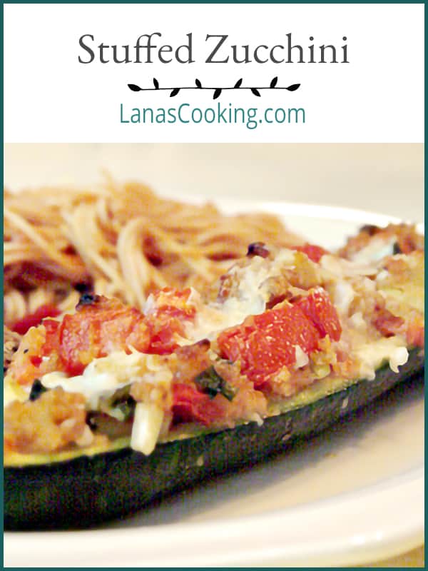 Stuffed Zucchini - fresh zucchini from the garden filled with a stuffing of onion, tomato, bread crumbs and parmesan cheese. https://www.lanascooking.com/stuffed-zucchini/
