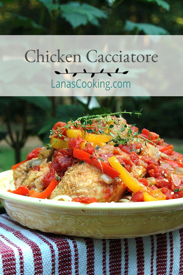 Chicken Cacciatore with tomatoes, peppers, and onions slowly stewed and served over pasta. An Italian favorite for family dinners. https://www.lanascooking.com/chicken-cacciatore/