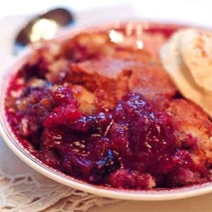 Mixed Berry Cobbler - warm from the oven cobbler of strawberries, blueberries, raspberries and blackberries. https://www.lanascooking.com/mixed-berry-cobbler/