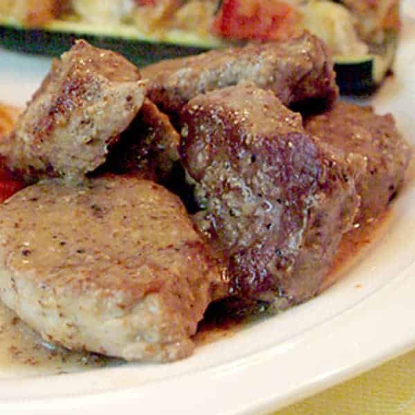 Pork Tenderloin with Mustard Sauce - lovely, flavorful pork tenderloin cooked quickly and coated with a coarse mustard pan sauce. https://www.lanascooking.com/pork-tenderloin-with-mustard-sauce/