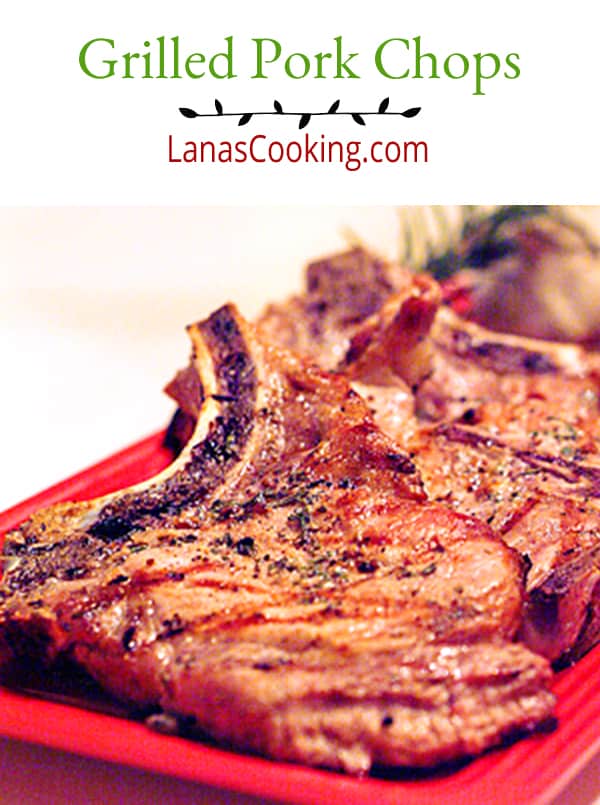 Grilled Pork Chops - pork chops seasoned with a fresh rosemary and garlic rub and cooked on an outdoor grill. Serve with your favorite green vegetables. https://www.lanascooking.com/grilled-pork-chops