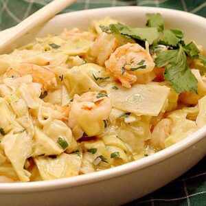 Shrimp and Artichoke Pasta - fresh shrimp and artichoke hearts combine with creamy garlic noodles in this easy and quick dinner dish. https://www.lanascooking.com/shrimp-and-artichokes-with-noodles/
