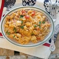 My Red Rice is a one-pot meal of rice, chicken, and tomatoes, based on the famous Charleston Red Rice. Low country cooking at its finest! https://www.lanascooking.com/red-rice/