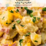 Ham and potato bake with parsley on top.