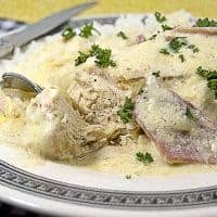 Neena's Company Chicken recipe is a twist on the classic using country ham in place of chipped beef. https://www.lanascooking.com/neenas-company-chicken/