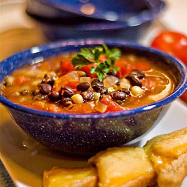 Black and White Bean Soup - Black and navy beans combined in a beefy, tomato broth for a substantial dinner soup. https://www.lanascooking.com/black-white-bean-soup