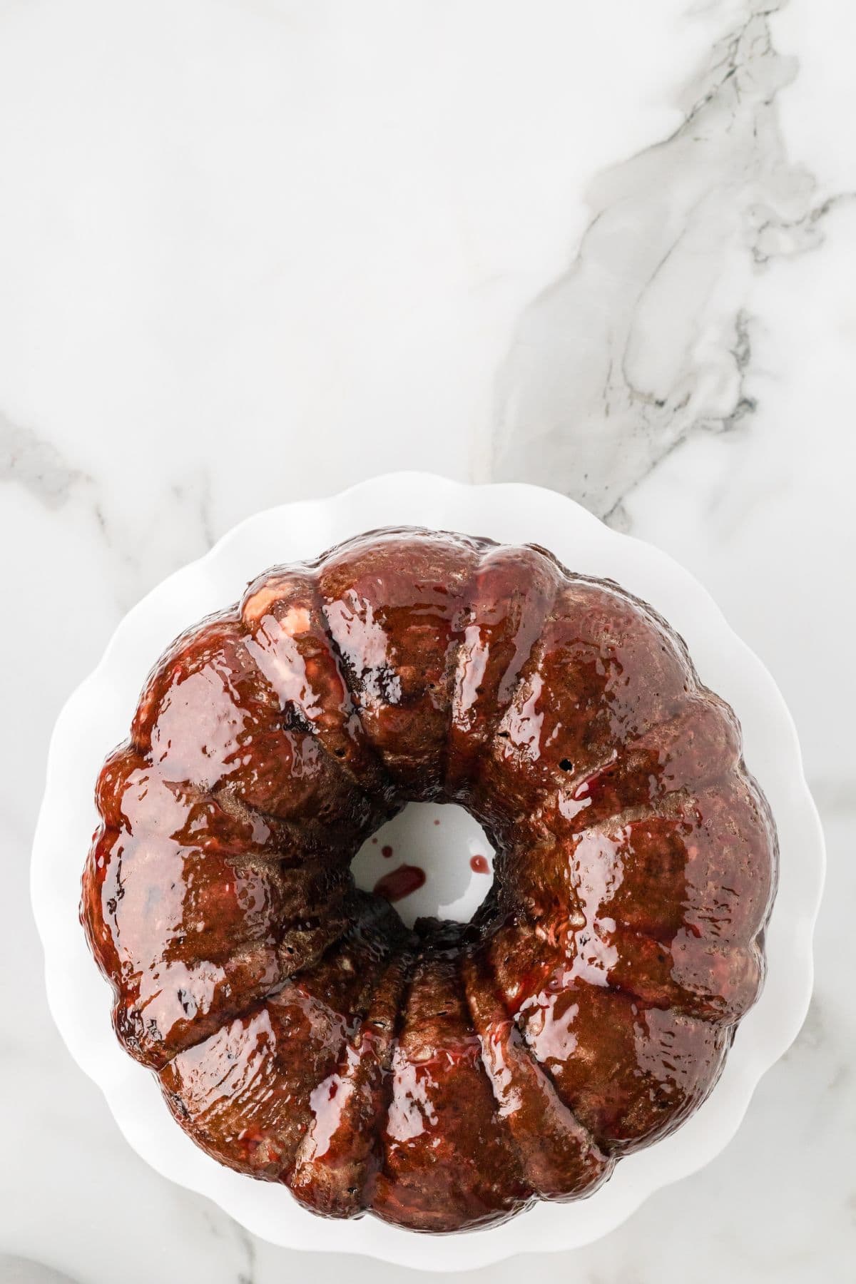 Cake brushed with raspberry glaze.