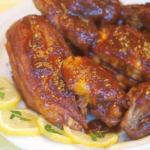 Smothered Barbecued Chicken - sticky, sweet, tender chicken slowly simmered and smothered in a rich, thick barbecue sauce. https://www.lanascooking.com/smothered-barbecued-chicken/