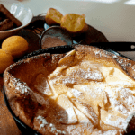 A light fluffy Dutch baby is just a big pancake cooked in the oven! Topped with lemon juice and powdered sugar, this breakfast treat is simply delicious. https://www.lanascooking.com/dutch-baby/