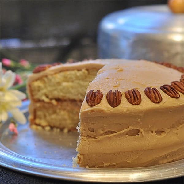 Southern caramel layer cake - moist yellow cake layers topped with a caramel frosting. A favorite of everyone in our family. https://www.lanascooking.com/caramel-layer-cake