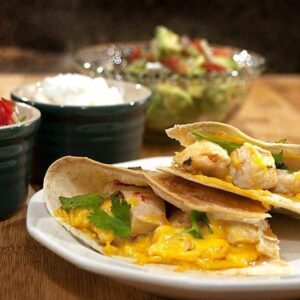 Healthy low-fat Chicken Quesadillas served up with a bright, fresh Avocado Salad. Enjoy these two complimentary recipes for an easy, guilt-free dinner. https://www.lanascooking.com/chicken-quesadillas-with-avocado-salad-cooking-to-combat-cancer/