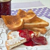 Homemade Strawberry Jam made with fresh, ripe strawberries, sugar, and lemon juice and no preservatives. https://www.lanascooking.com/strawberry-jam/