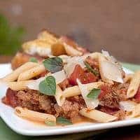 Pasta with Italian Sausage and Tomatoes - a quick and easy weeknight dinner of Penne pasta with Italian sausage and tomatoes. https://www.lanascooking.com/pasta-with-italian-sausage-tomatoes/