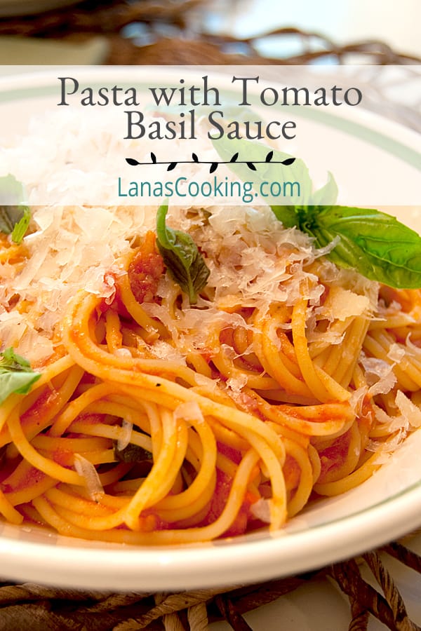 This Pasta with Tomato Basil Sauce is a perfect summer dinner. Pasta is tossed with tomatoes and loads of fresh basil. Topped with Parmigiano Reggiano. https://www.lanascooking.com/pasta-with-tomato-basil-sauce/