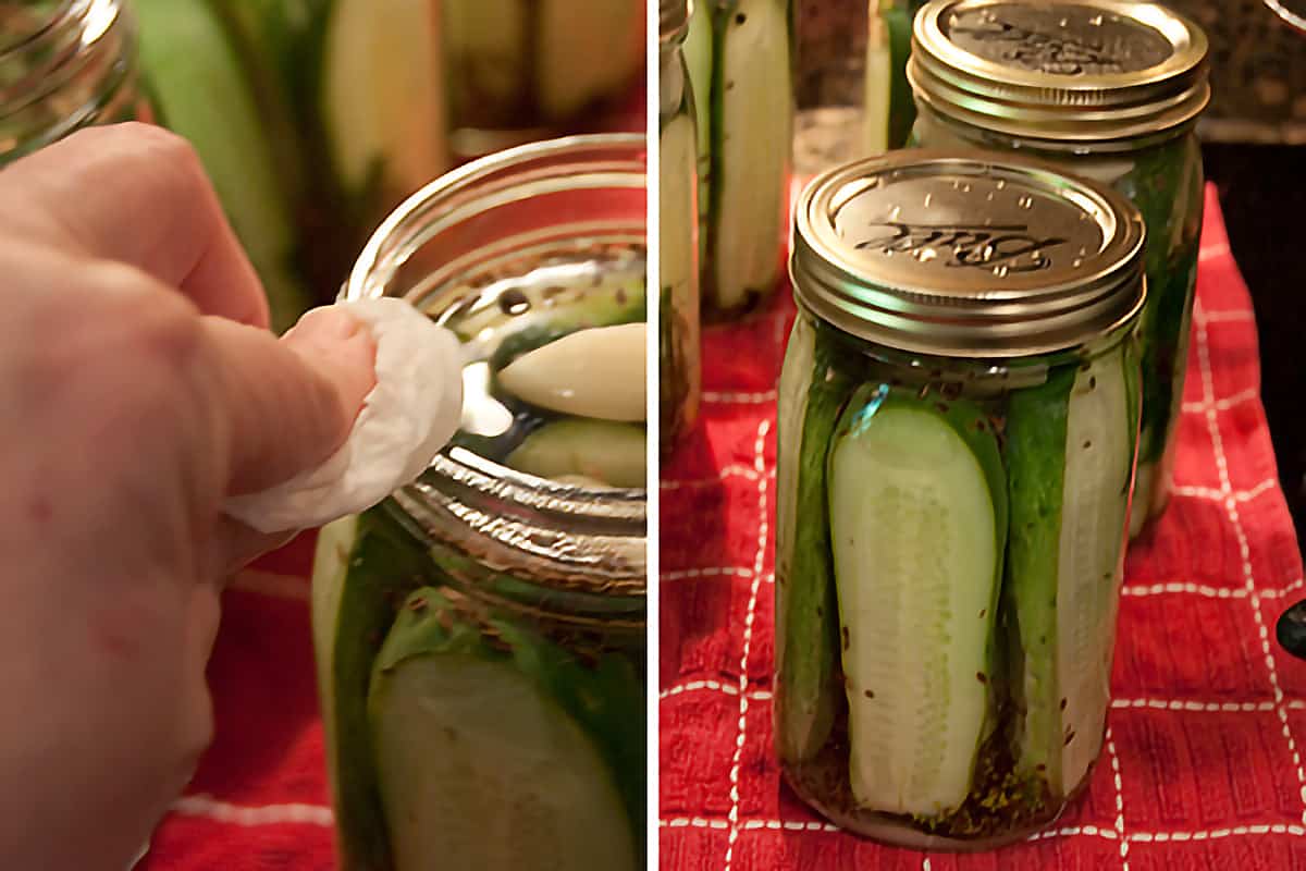 Hand wiping the jar rims with a paper towel; Filled jars with lids and rings applied.