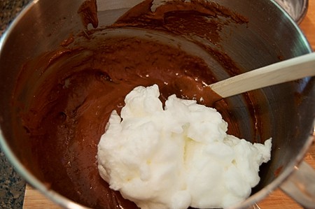 Folding egg whites into chocolate batter.