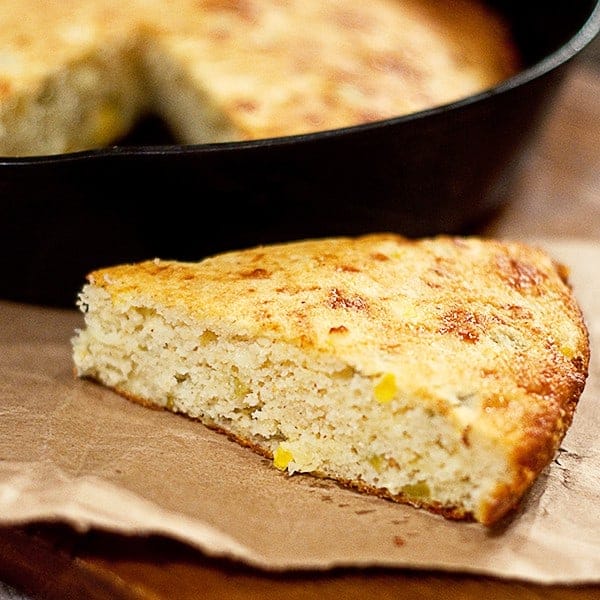 This Cheesy Chili Cornbread is a southern style cornbread with loads of sharp cheddar cheese and green chilies. https://www.lanascooking.com/cheesy-chili-cornbread