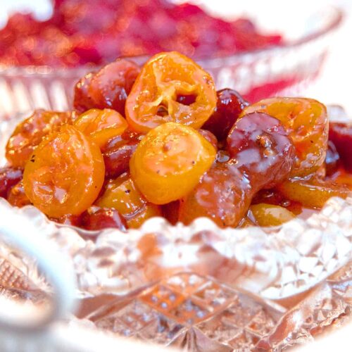 Kumquat and Dried Cherry Chutney in a cut glass serving dish.