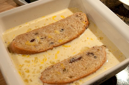 Two slices of bread added to the egg mixture.