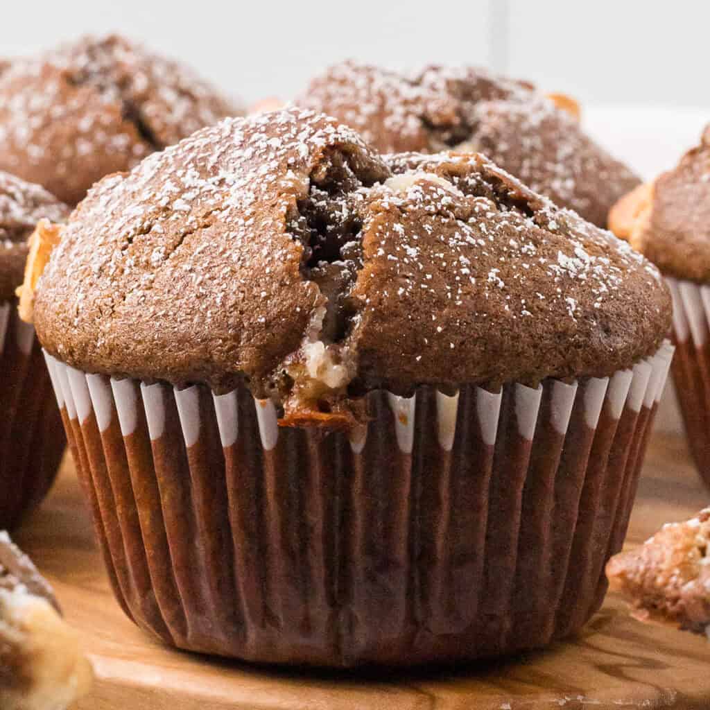 A single muffin viewed side-on.