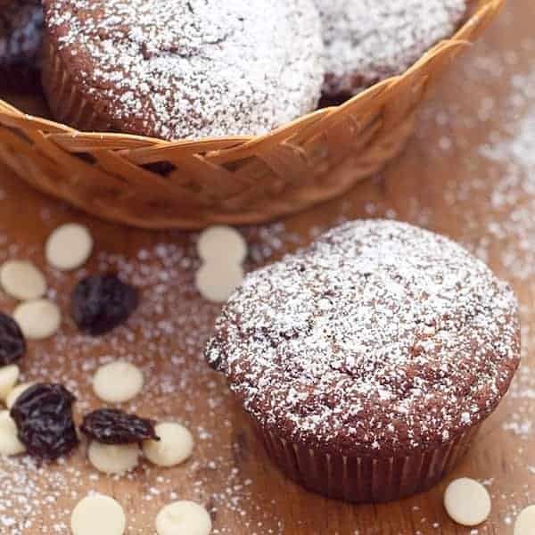 Chocolate Cherry Muffins with white chocolate chips and dried cherries. A quick to make, fun to eat, tempting sweet treat. https://www.lanascooking.com/chocolate-cherry-muffins/