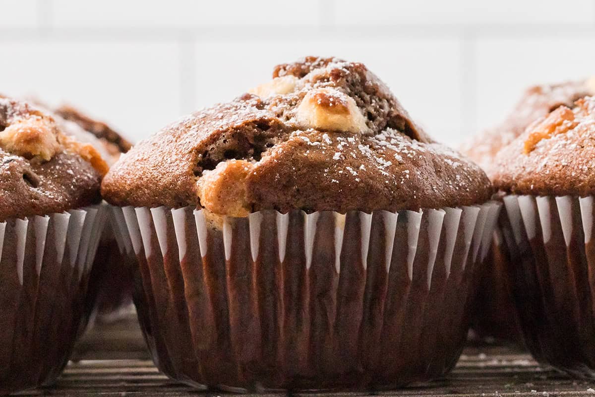 A single muffin viewed side-on.