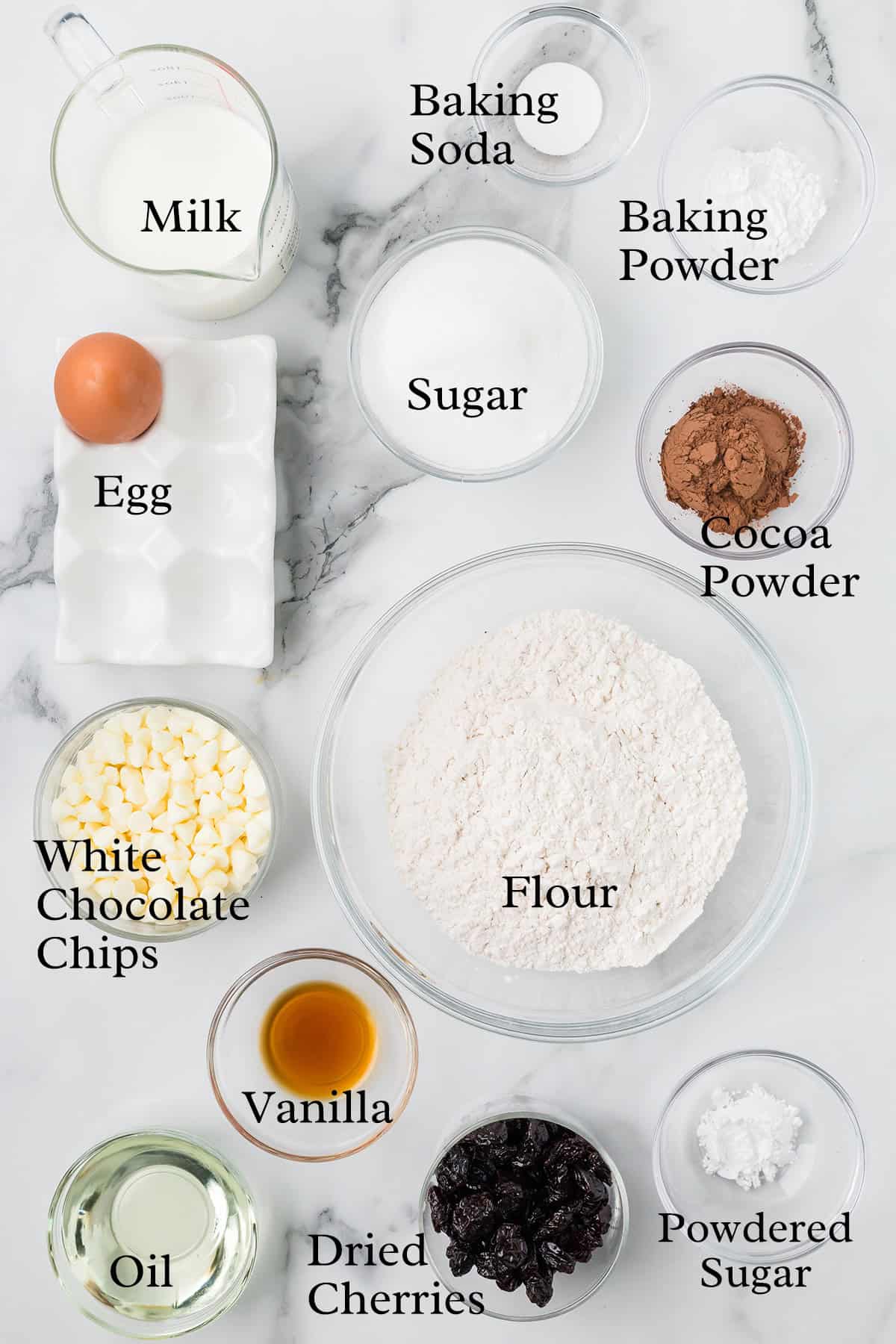 Ingredients needed to make chocolate cherry muffins.
