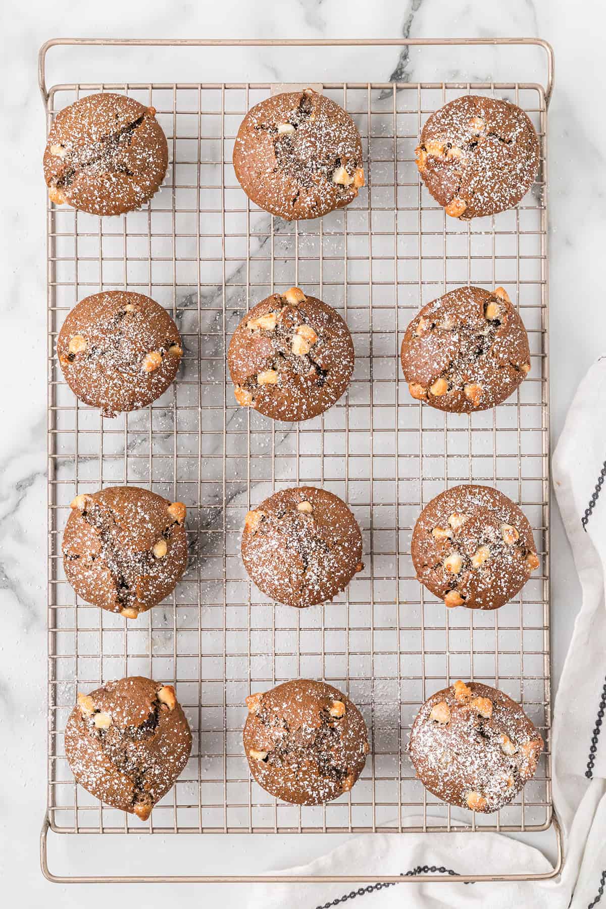 Muffins dusted with powdered sugar.